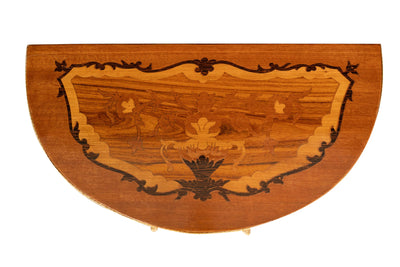 Biscottini Consolle a mezzaluna in legno impiallacciato noce arricchito con particolari intarsi fatti a mano e decori in bronzo